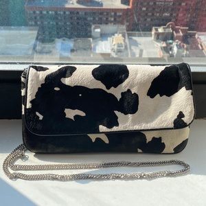 Steve Madden Black and White cowprint heard clutch purse.